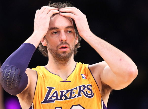 Lakers center Pau Gasol piushes his hair out of his eyes  during the game against the Golden State