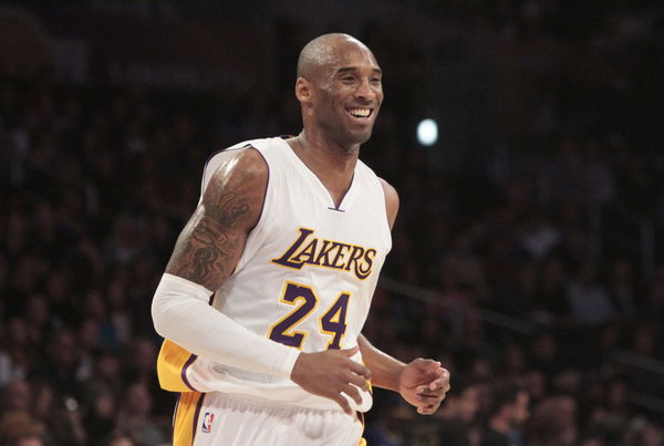 LOS ANGELES, CA. JAN. 04, 2015. Lakers&#8217; #24 Kobe Bryant all smiles after an assist from teammate Car