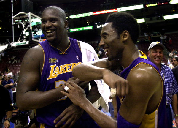 Lakers Shaquille O&#8217;Neal and Kobe Bryant celebrate after defeating the 7