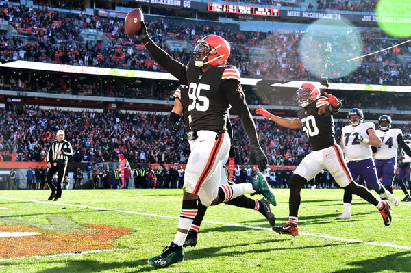 Myles Garrett Cleveland Browns Unsigned Celebrates A Sack in White Jersey Photograph