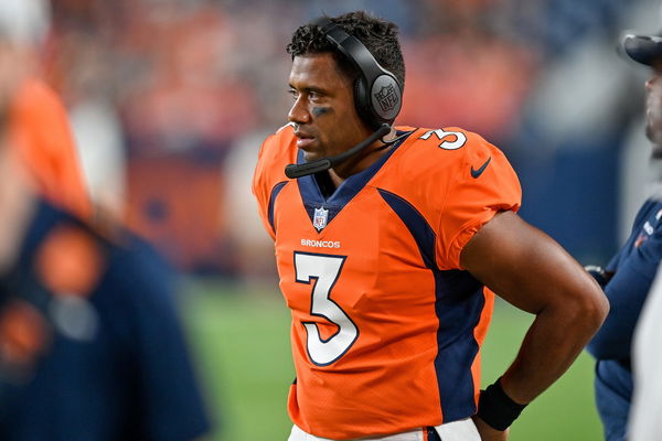 DENVER, CO - DECEMBER 11: Denver Broncos quarterback Russell Wilson (3)  scrampes out of the pocket in the first quarter during a game between the  Kansas City Chiefs and the Denver Broncos