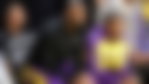 LeBron James and Bronny James are sitting courtside