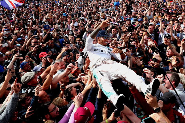 Lewis Hamilton with fans during a Grand Prix