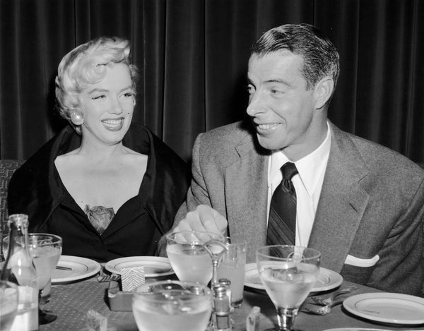 Marilyn Monroe and Joe diMaggio at a Restaurant