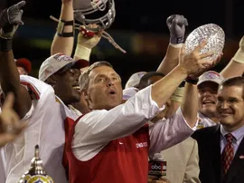 OState coach Jim Tressel holds 2003 Fiesta Bowl championship trophy
