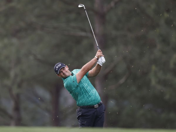 Patrick Reed hits approach shot to the first green during the first round at the Masters tournament at Augusta National