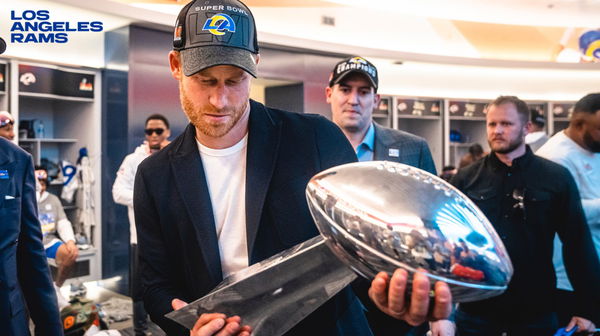 Prince Harry with the Super Bowl trophy in the Rams locker room