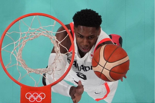 RJ Barrett shoots against Australia in a men&#8217;s group stage basketball match during the Paris 2024 Olympic Summer Games at Stade Pierre-Mauroy