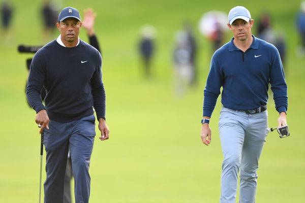 PACIFIC PALISADES, CA &#8211; FEBRUARY 16: Tiger Woods and Rory McIlroy walk to the 18th green during the first round of the G