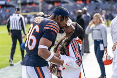 CHICAGO, IL &#8211; NOVEMBER 10: Olympic Gymnast Simone Biles kisses her husband, Jonathan Owens 36 of the Chicago Bears, on t