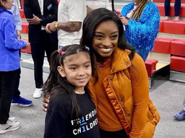 Simone Biles with a fan