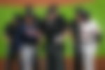 Brian Snitker and Dusty Baker Jr. meet with umpires Chris Conroy, Tom Hallion, Dan Bellino, Ted Barrett, Mike Muchlinski, and Alfonso Marquez