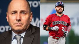 Brian Cashman and Eugenio Suarez