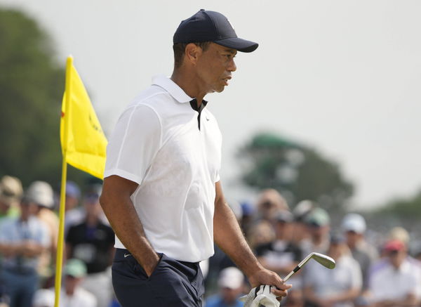 Tiger Woods walks on the green on the second hole during the first round at the Masters tournament at Augusta National G