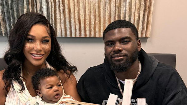 Tyler Huntley with his GF and son