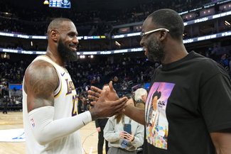 LeBron James talks with Draymond Green
