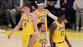 Luka Doncic and Austin Reaves with their Lakers teammates