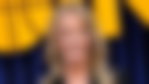 Jeanie Buss posing for picture on a red carpet event