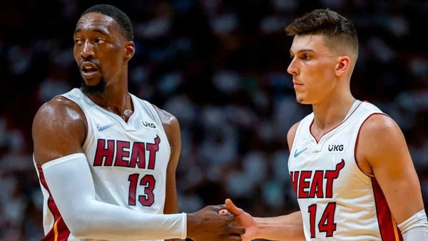 May 14, 2022: Miami Heat teammates Bam Adebayo (13) and Tyler Herro (14) shake hands during Game 1 in the Eastern Confer