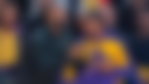 LEBRON JAMES, left, stands with his son BRONNY JAMES, right, ready to play