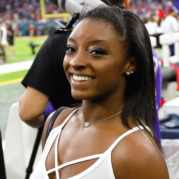 Simone Biles Wears a Red Owens Sweatshirt For Jonathan Owens