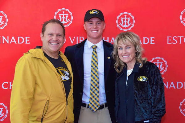 Brady Cook and his parents