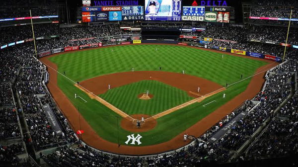 Yankee Stadium at night time Featured Image