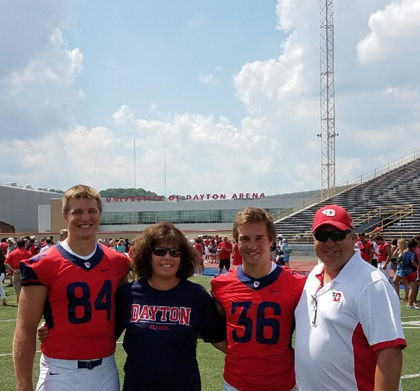 adam trautman with his parents