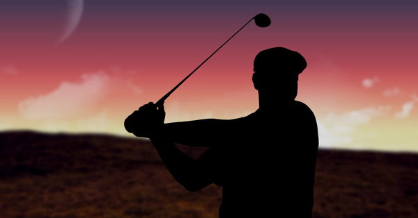 Composition of silhouette of male golf player over landscape and pink sky with copy space Compositio