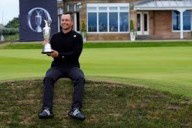 Xander Schauffele holding the Claret Jug