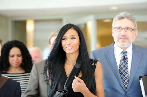 May 03, 2012: Pilar Sanders, flanked by her attorney, Larry Friedman, exits the Collin County Courth