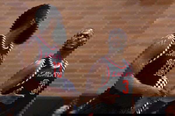 LOS ANGELES CA JULY 30 Houston Rockets guards Chris Paul 3 talks with James Harden 13 during