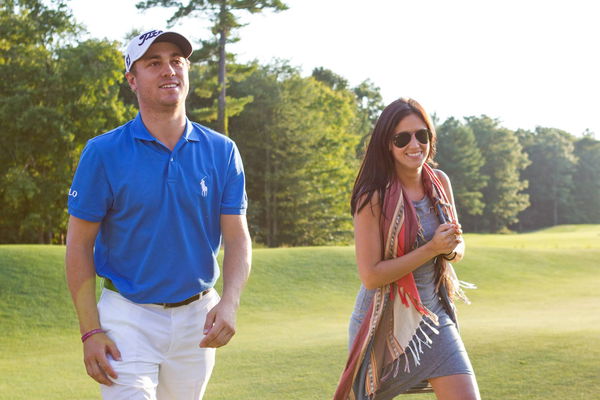 September 4, 2017; Norton, MA, USA; Justin Thomas walks off the course with girlfriend Jillian Wisni