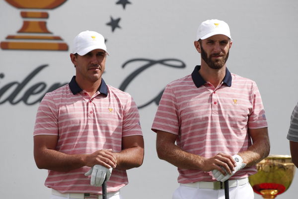 JERSEY CITY NJ SEPTEMBER 29 USA golfers Brooks Koepka and Dustin Johnson wait to tee off on the