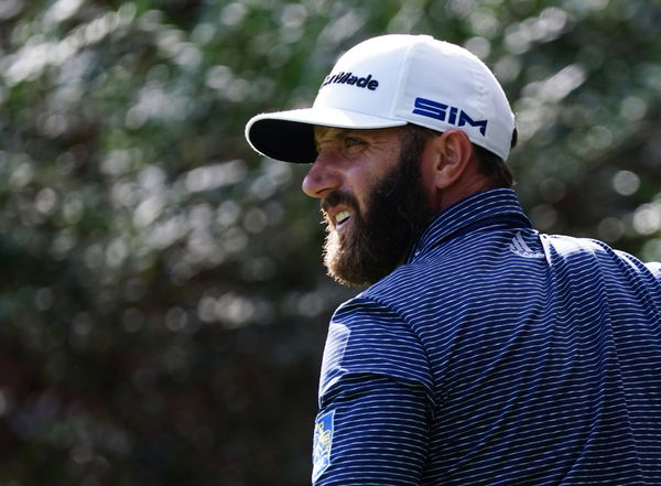 Dustin Johnson watches his tee shot on the 14h hole in the final round of the 2020 Masters golf tournament at Augusta Na