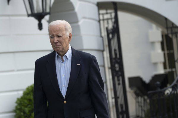 United States President Joe Biden walks to reporters as he departs the White House in Washington, DC, to visit tornado d