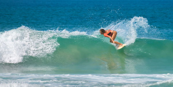 RECORD DATE NOT STATED  Ahangama, Sri Lanka &#8211; 03 26 2023: Attractive young pro surfer girl in action on RedBull ride my