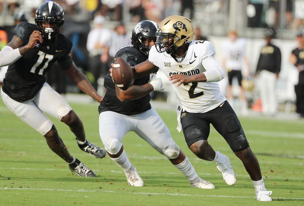 SPORTS-FBC-COLORADO-UCF-NOTES-6-OS Colorado quarterback Shedeur Sanders (2) scrambles against UCF at FBC Mortgage Stadiu