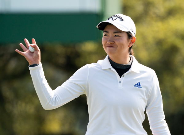 Rose Zhang watches as she walks off the 18th green during the Augusta National Women s Amateur Tournament at Augusta Nat