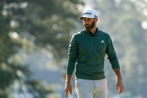 Dustin Johnson lines up a putt during a practice round before the start of the 2021 Masters Tournament at Augusta Nation