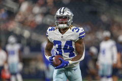 ARLINGTON, TX &#8211; AUGUST 21: Dallas Cowboys running back Rico Dowdle (34) makes a catch during warmups for the game betwee