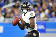 Baltimore Ravens vs Detroit Lions Baltimore Ravens quarterback Lamar Jackson (8) looks to pass the ball during an NFL, A