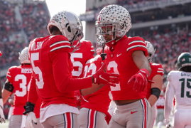November 20, 2021, Columbus, Ohio, U.S: Ohio State Buckeyes wide receiver Garrett Wilson (5) is congratulated by Ohio St
