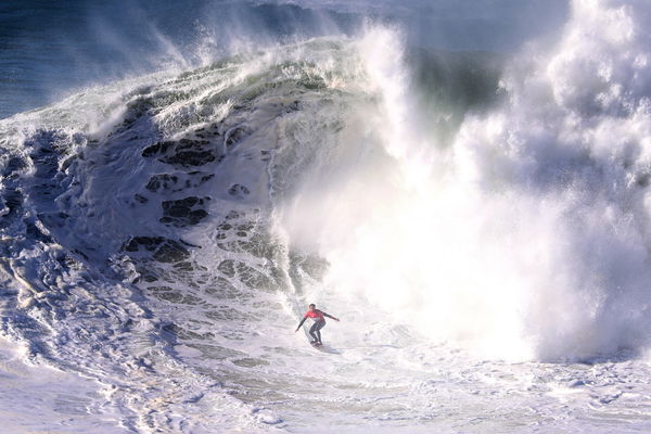 (211214) &#8212; NAZARE, Dec. 14, 2021 &#8212; Big wave surfer Kai Lenny from Hawaii competes during the Tudor Nazare Tow Surfing