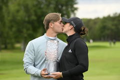 Linn Grant of Sweden is congratulated by her caddie and boyfriend Pontus Samuelsson after winning the Scandinavian Mixe