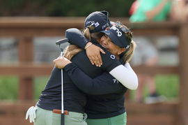 Dow Great Lakes Bay Invitational Lizette Salas (right) and Jennifer Kupcho (left), of Team Youth On Course, hug after w