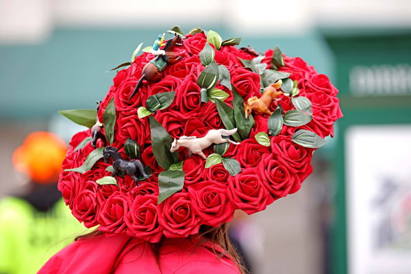 Horse Racing: 148th Kentucky Derby, May 7, 2022; Louisville, KY, USA; A fans wears a festive hat celebrates winning the