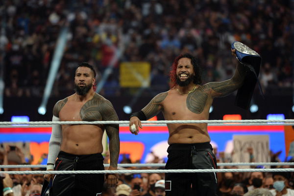 Wrestling: WWE SummerSlam 2021, Aug 21, 2021; Paradise, Nevada, USA; The Usos (black pants) and The Mysterios (pink/yell