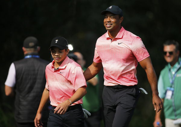 ORLANDO, FL &#8211; DECEMBER 17: Tiger and Charlie Woods walk down the first fairway during the first round of the PNC Champi