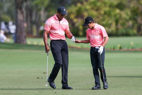 December 17, 2022, Orlancdo, Florida, USA: Tiger Woods (L) and Charlie Woods share a fist bump during the first round o